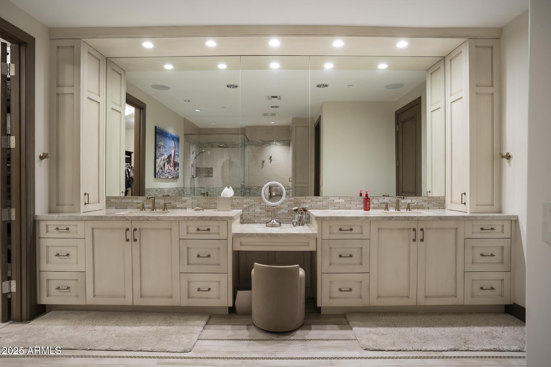 2211 East Camelback Road, Unit 1203 Phoenix, AZ 85016 - Photo 17 of 39 a bathroom with a sink vanity and mirror