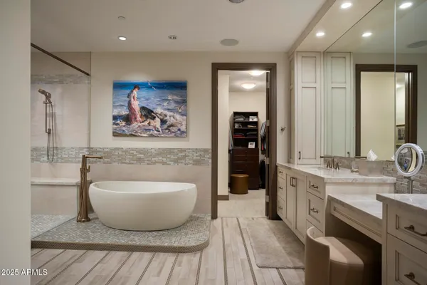 a bathroom with a sink vanity and mirror