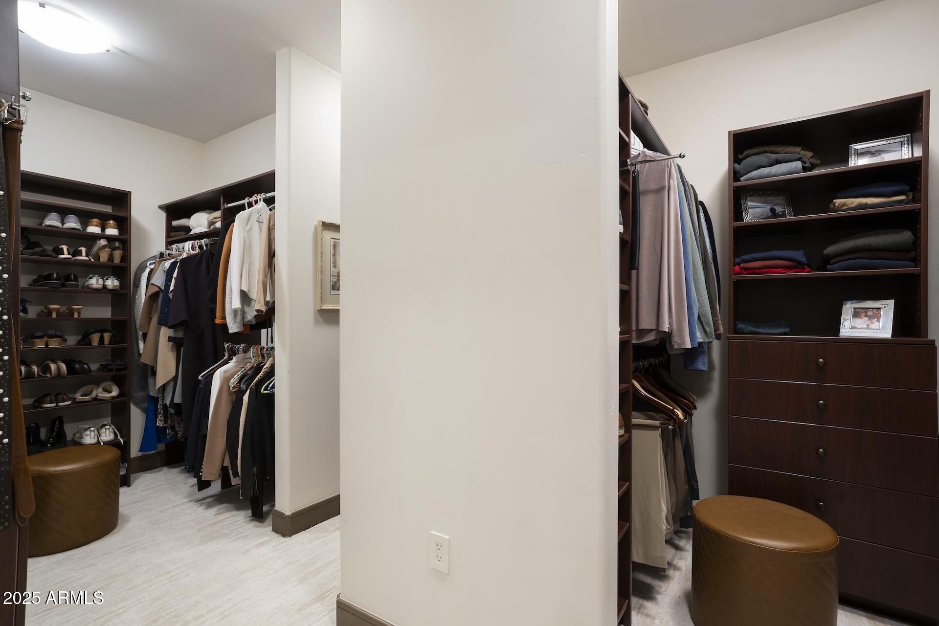 2211 East Camelback Road, Unit 1203 Phoenix, AZ 85016 - Photo 19 of 39 a view of walk in closet with clothes and shoes