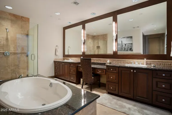 a bedroom with a bed tv and a window