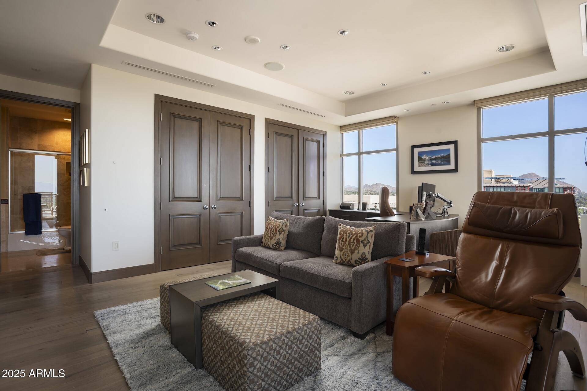 2211 East Camelback Road, Unit 1203 Phoenix, AZ 85016 - Photo 24 of 39 a living room with furniture
