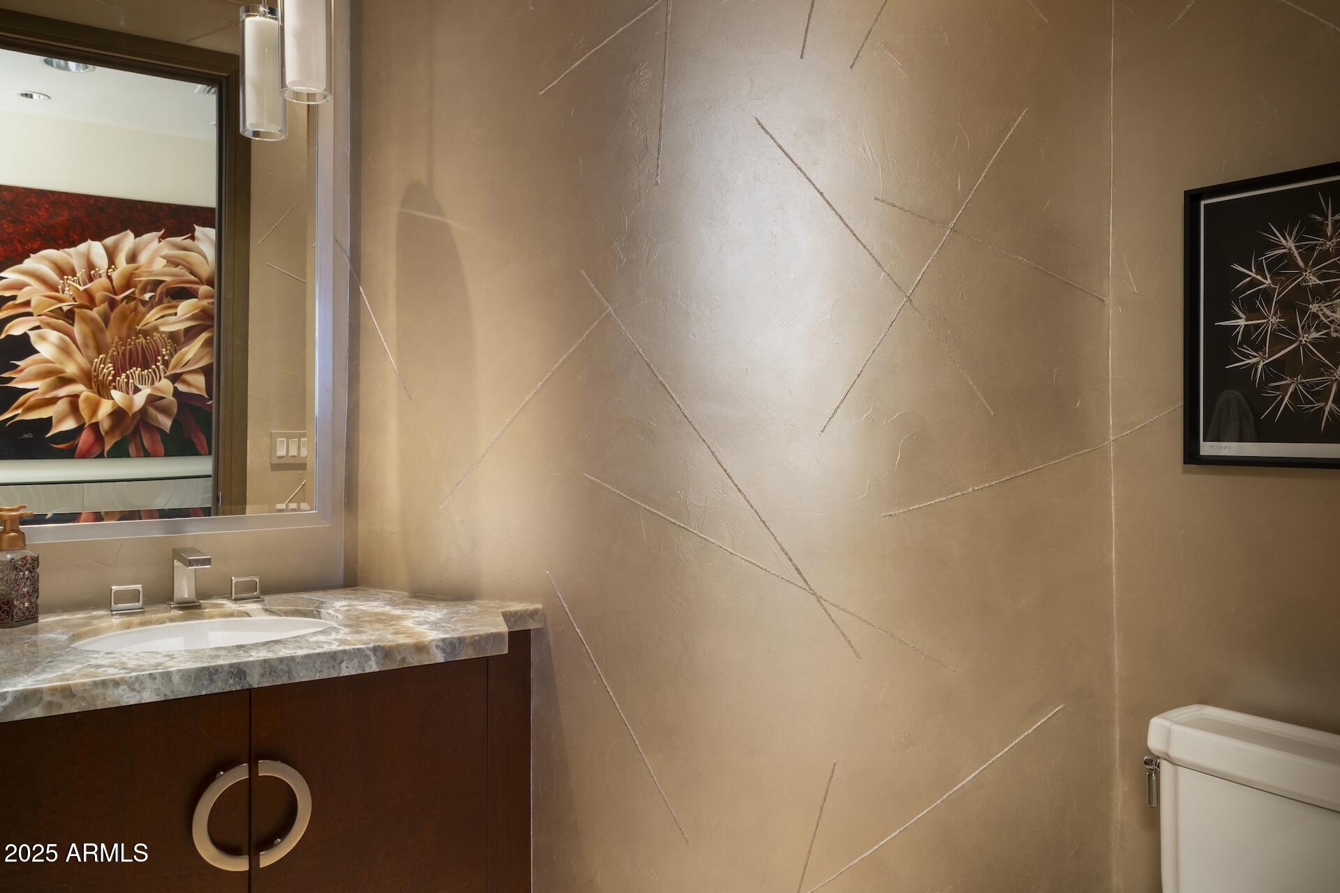 2211 East Camelback Road, Unit 1203 Phoenix, AZ 85016 - Photo 26 of 39 a bathroom with a granite countertop sink and a mirror