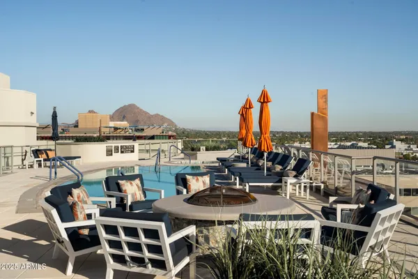 a view of a swimming pool with a lounge chair