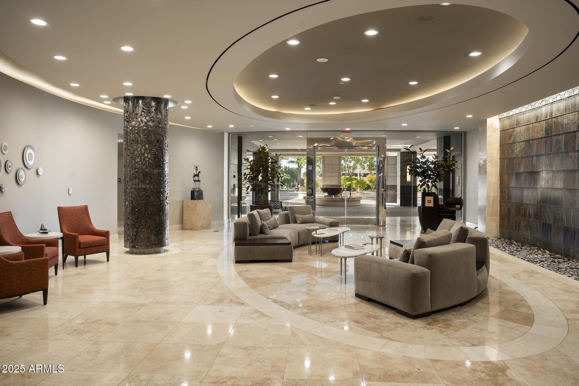 2211 East Camelback Road, Unit 1203 Phoenix, AZ 85016 - Photo 31 of 39 a living room with furniture and potted plant