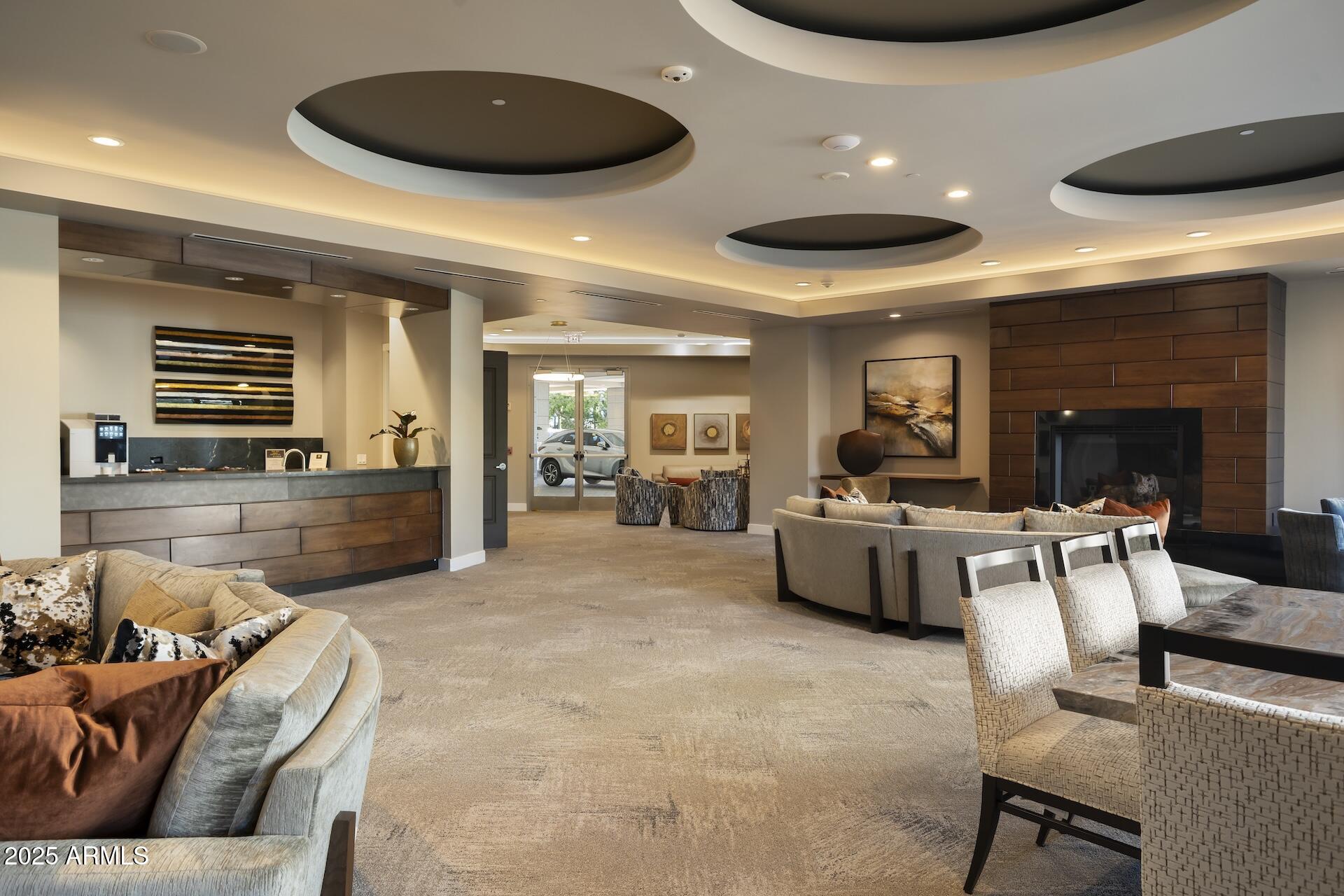 2211 East Camelback Road, Unit 1203 Phoenix, AZ 85016 - Photo 34 of 39 a living room with furniture and a wooden floor