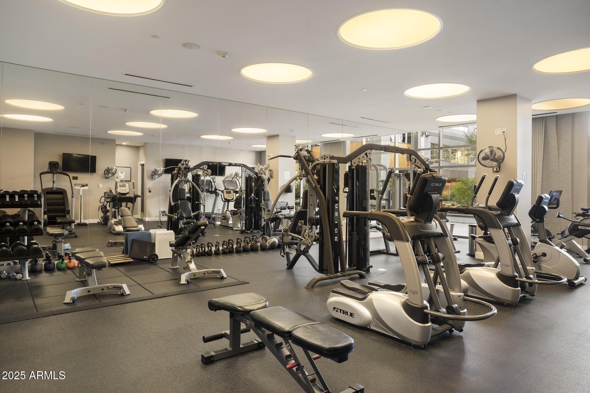 2211 East Camelback Road, Unit 1203 Phoenix, AZ 85016 - Photo 35 of 39 a view of a room with gym equipment