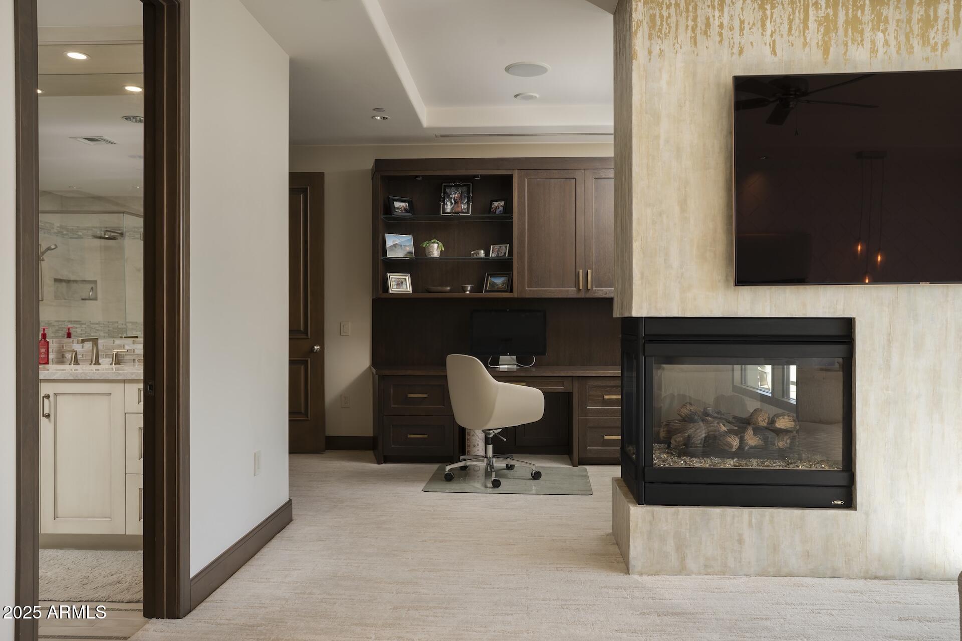 2211 East Camelback Road, Unit 1203 Phoenix, AZ 85016 - Photo 6 of 39 a living room with furniture and a fireplace