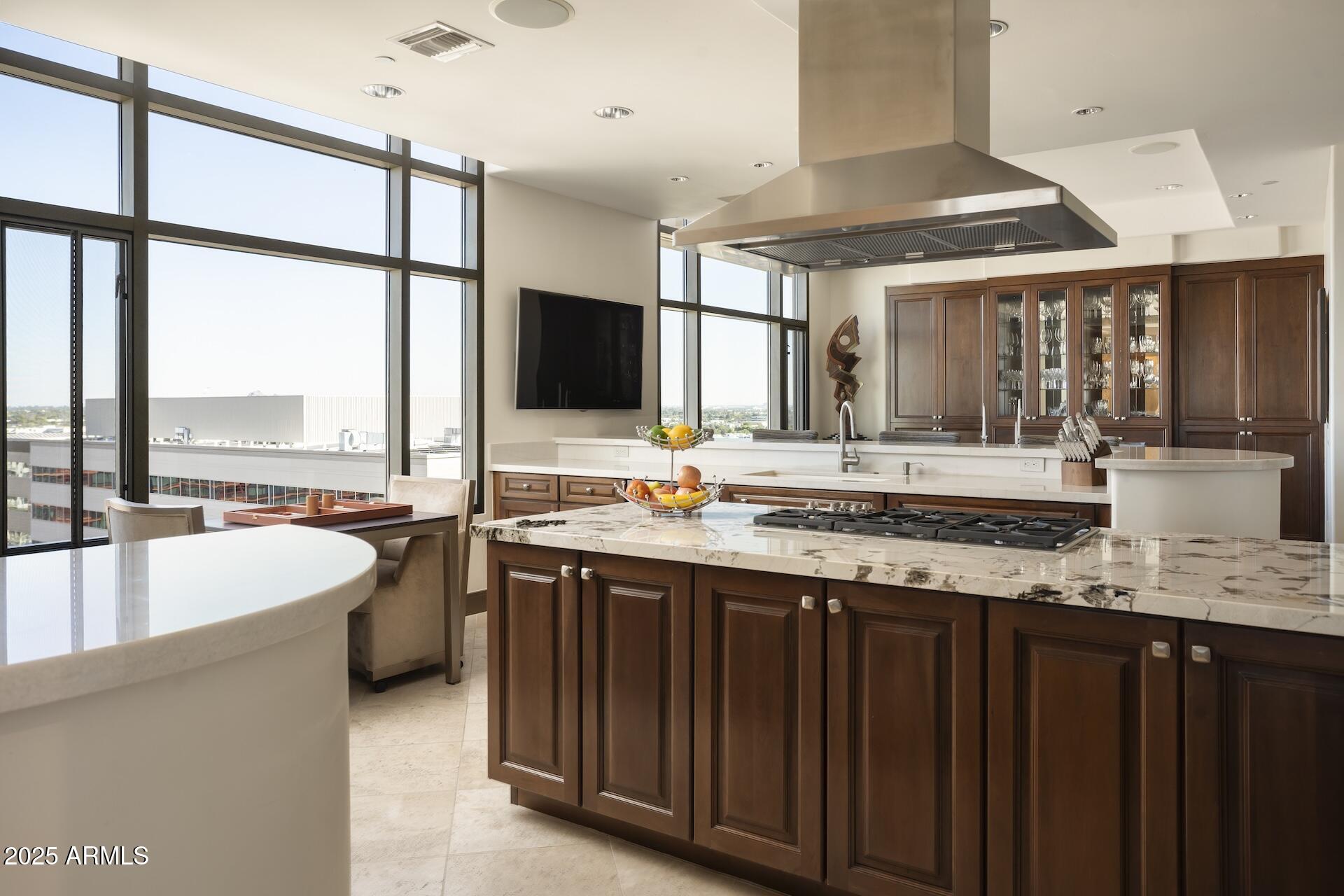 2211 East Camelback Road, Unit 1203 Phoenix, AZ 85016 - Photo 9 of 39 a large kitchen with a large window and a counter space