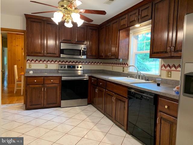 39 Sharp Rock Road Sperryville, VA 22740 - Photo 18 of 21 a kitchen with stainless steel appliances granite countertop a sink stove and oven