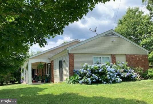 39 Sharp Rock Road Sperryville, VA 22740 - Photo 10 of 21 a view of a house with garden and yard