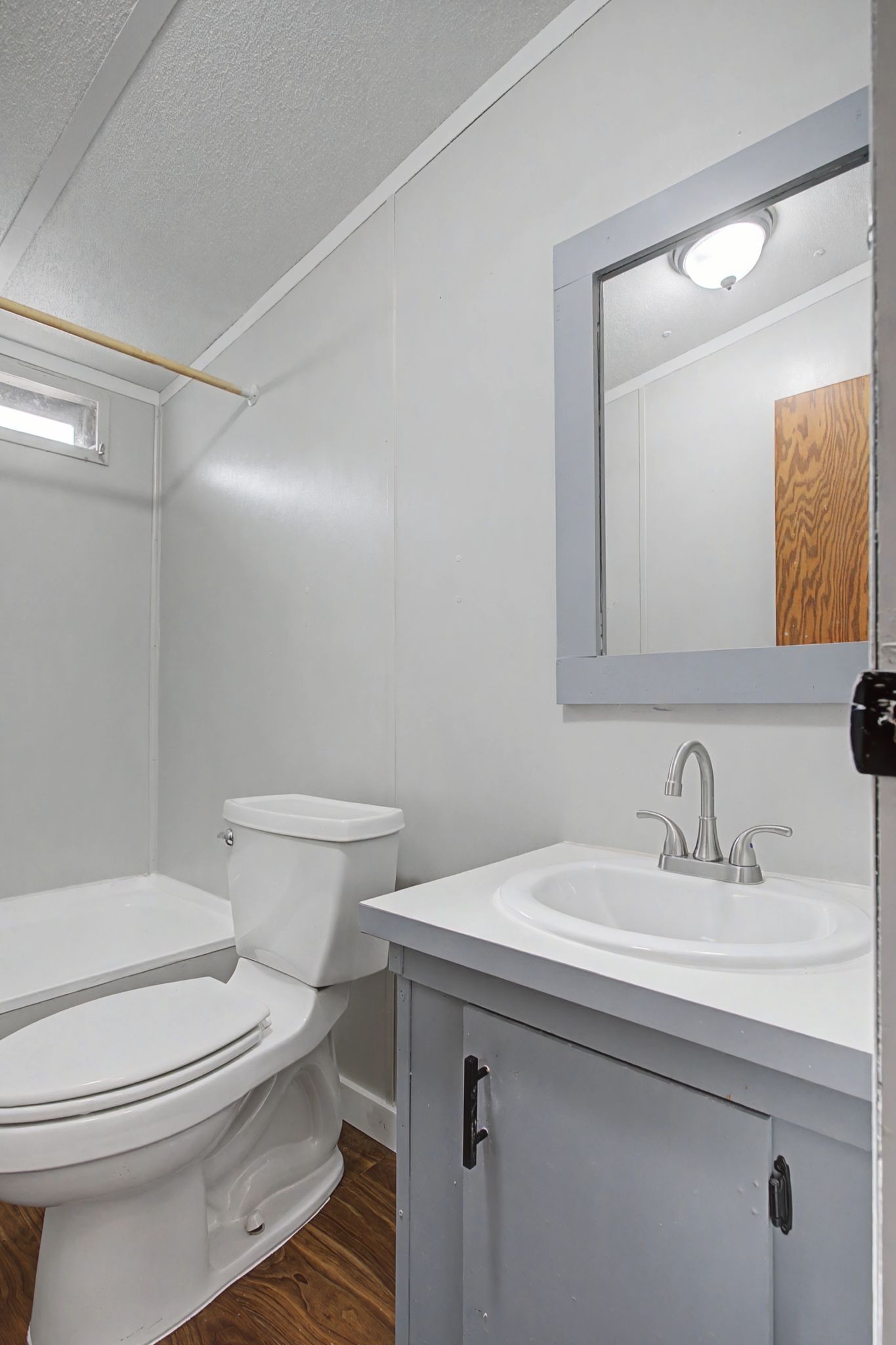 405 Napier Road Hohenwald, TN 38462 - Photo 14 of 37 a bathroom with a sink a toilet and shower
