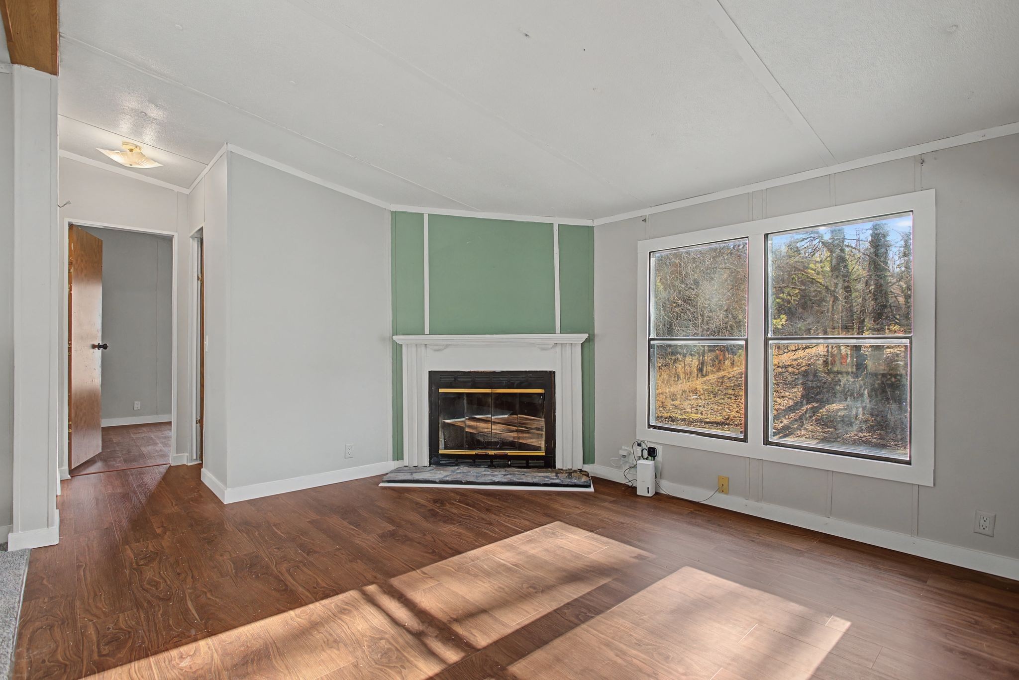 405 Napier Road Hohenwald, TN 38462 - Photo 25 of 37 a living room with furniture and a fireplace