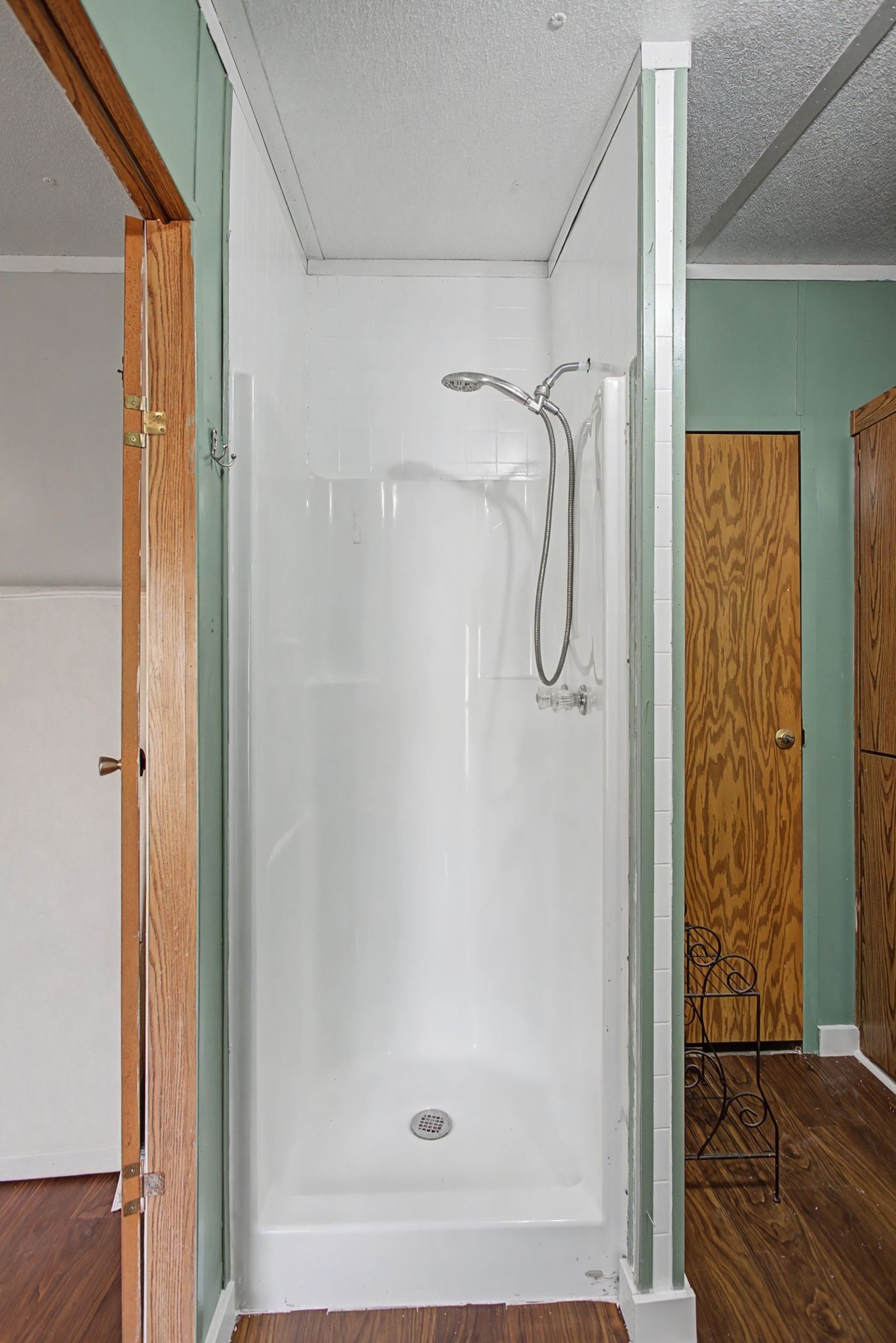 405 Napier Road Hohenwald, TN 38462 - Photo 9 of 37 a bathroom with a glass shower door