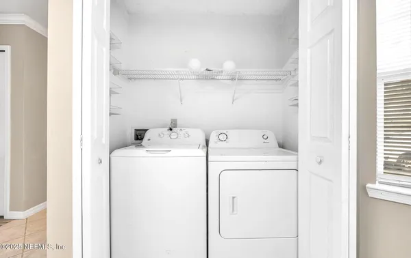 a utility room with dryer and washer