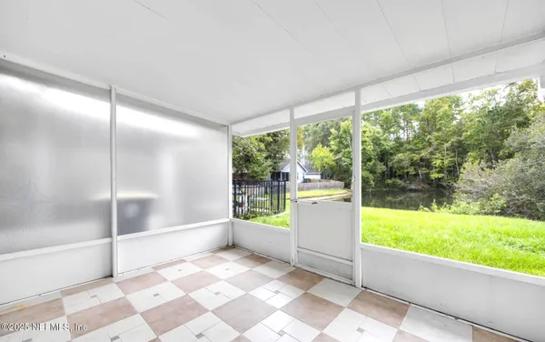 a view of an empty room with a large window