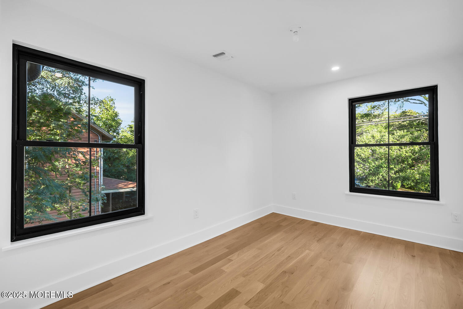 514 River Road Fair Haven, NJ 07704 - Photo 13 of 62 an empty room with wooden floor and windows