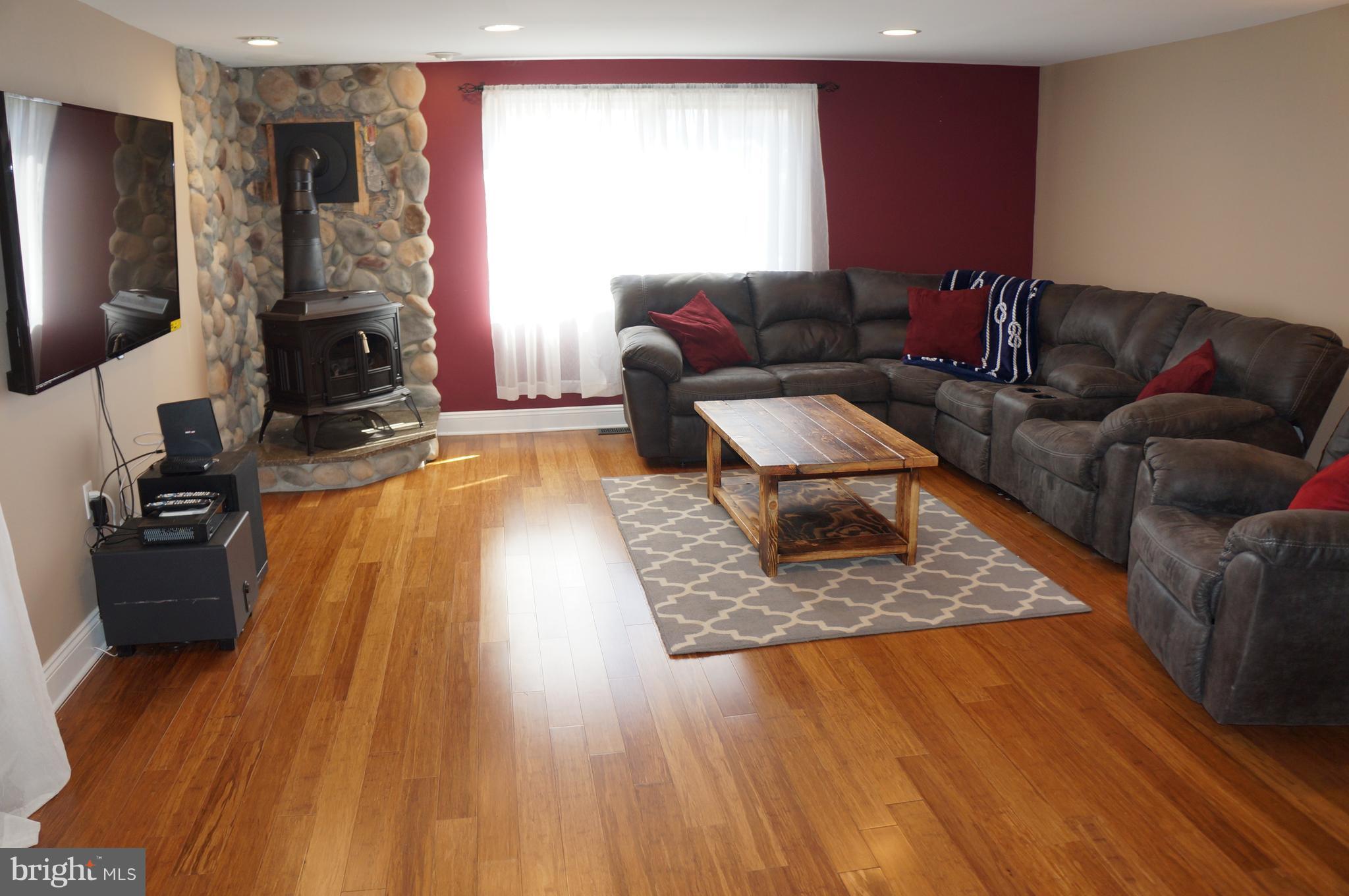 7758 Twin Oaks Road Severn, MD 21144 - Photo 8 of 28 Living Room Wood Stove W/River Roc