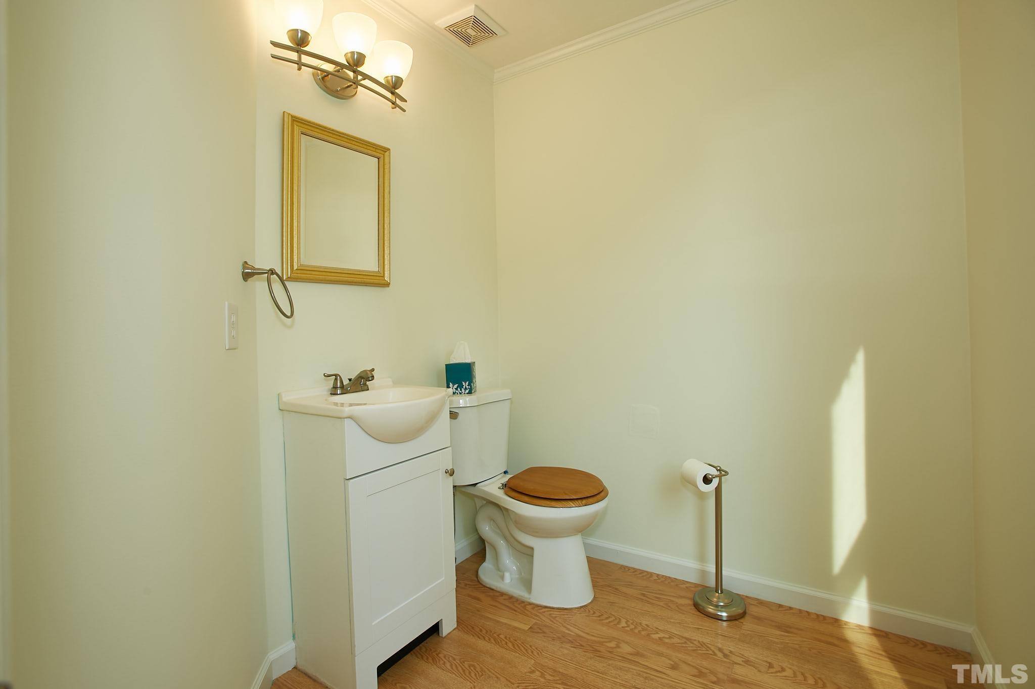4616 Knightsbridge Way Raleigh, NC 27604 - Photo 11 of 27 a bathroom with a sink and toilet