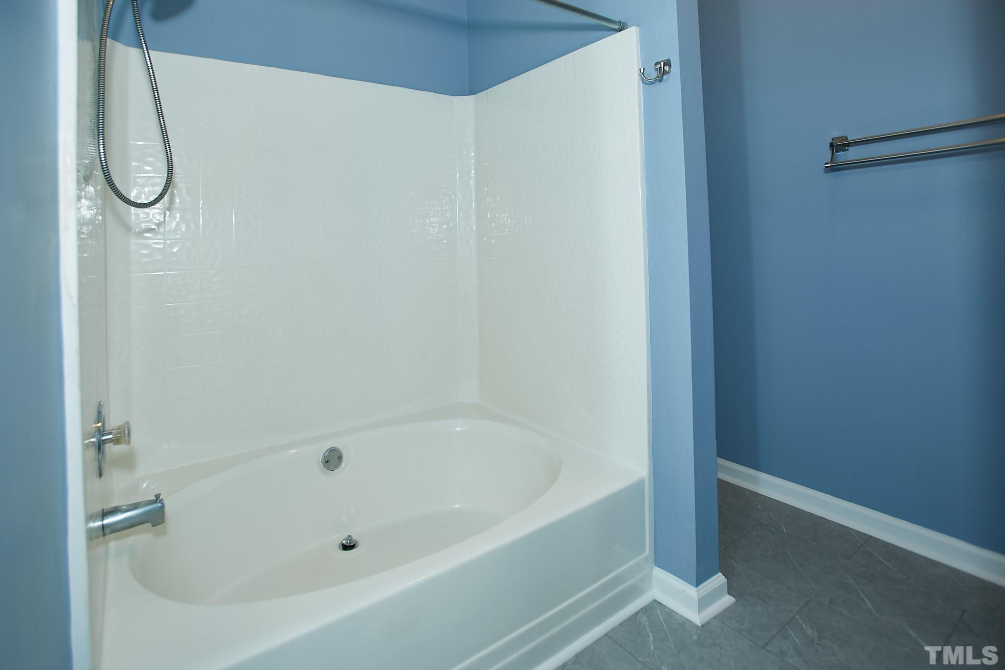4616 Knightsbridge Way Raleigh, NC 27604 - Photo 21 of 27 a bathroom with a bath tub and a shower