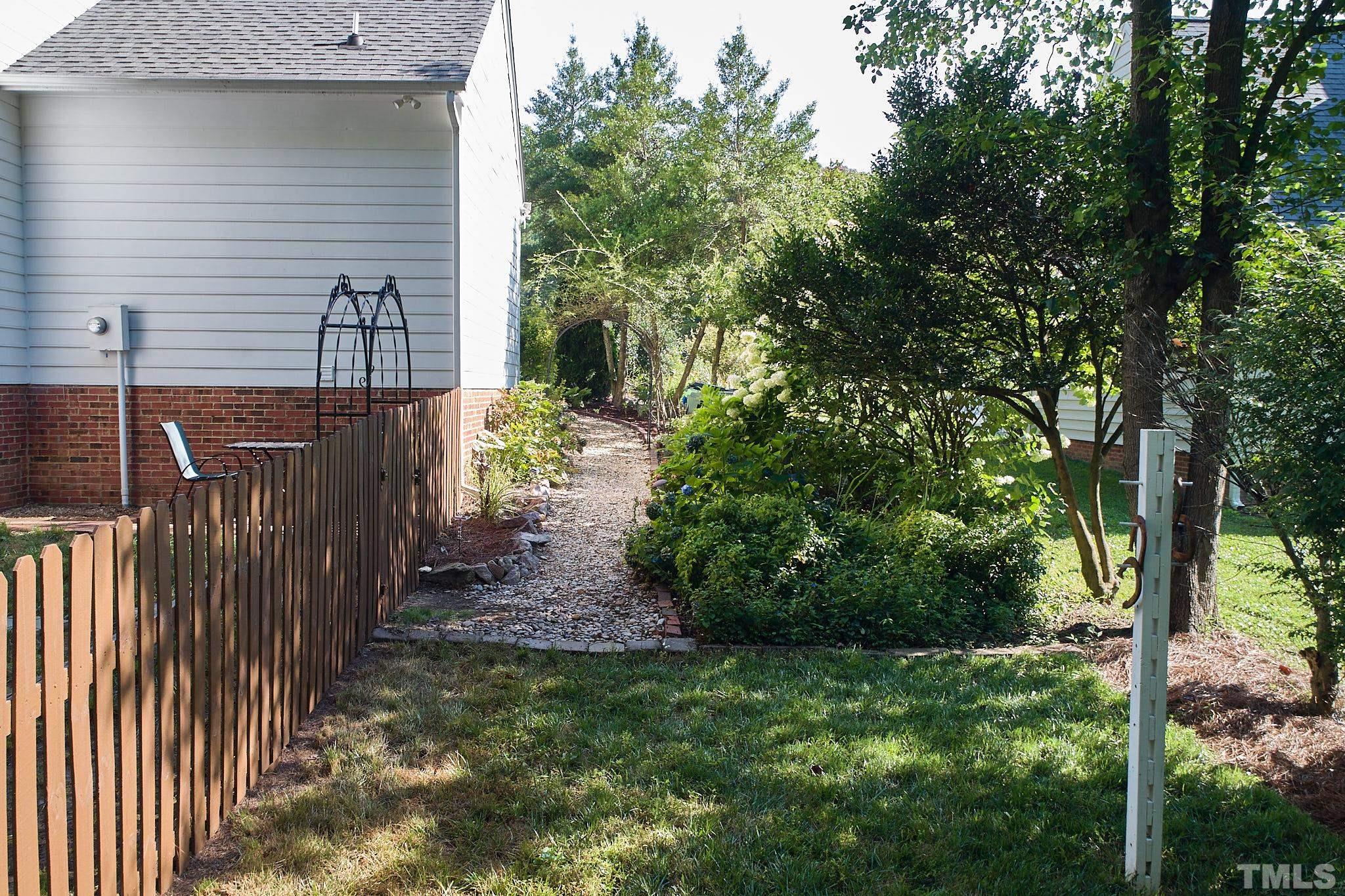 4616 Knightsbridge Way Raleigh, NC 27604 - Photo 25 of 27 a view of a backyard with pathway