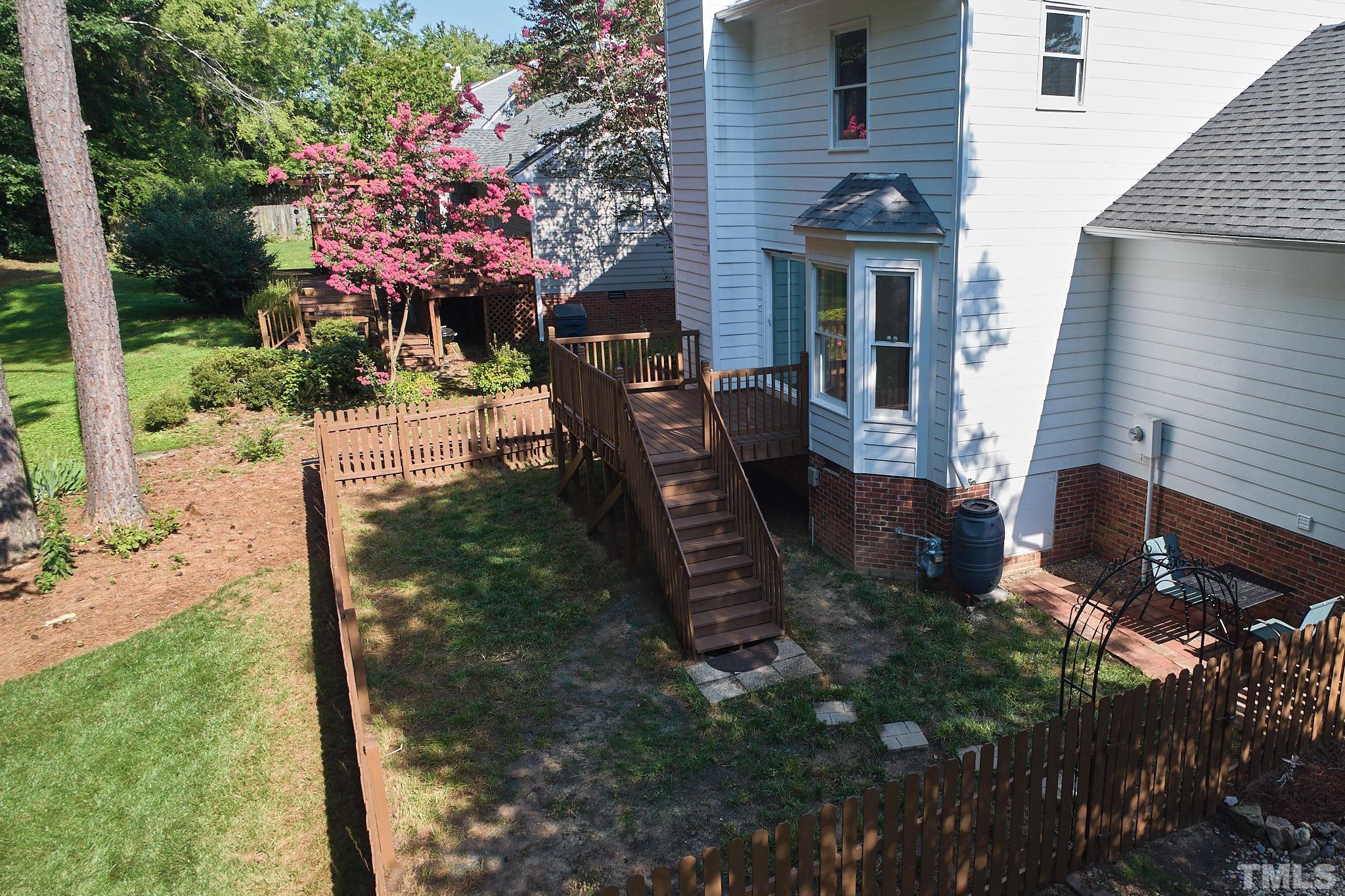 4616 Knightsbridge Way Raleigh, NC 27604 - Photo 26 of 27 a view of a house with backyard and sitting area