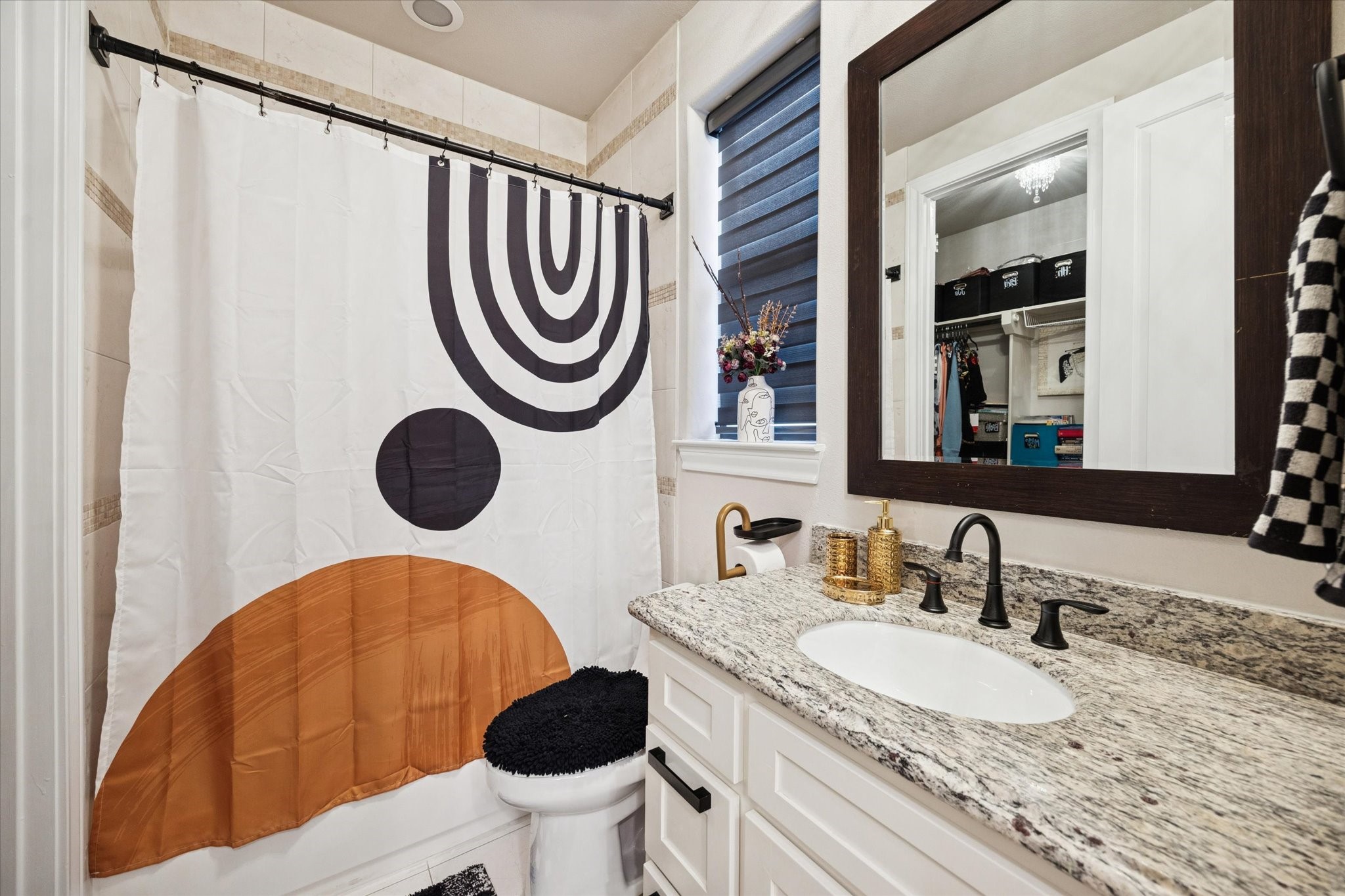 5820 Darling Street Houston, TX 77007 - Photo 11 of 24 a bathroom with a granite countertop sink and a mirror