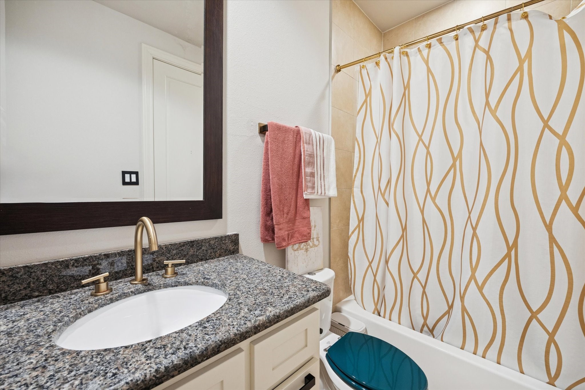 5820 Darling Street Houston, TX 77007 - Photo 15 of 24 a bathroom with a granite countertop sink and a mirror
