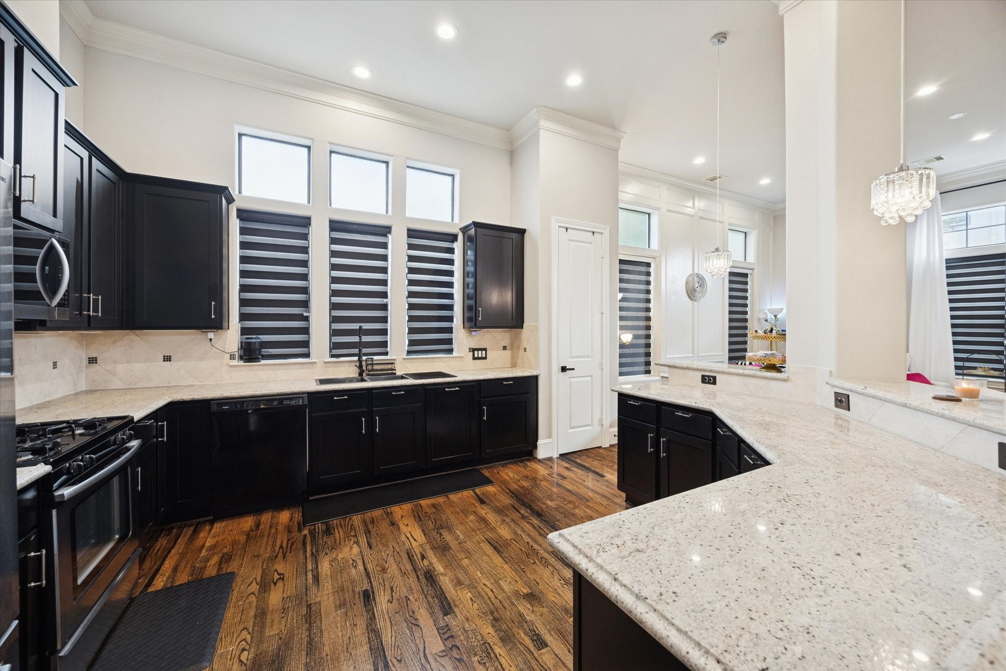5820 Darling Street Houston, TX 77007 - Photo 18 of 24 a kitchen with a stove a sink and a refrigerator