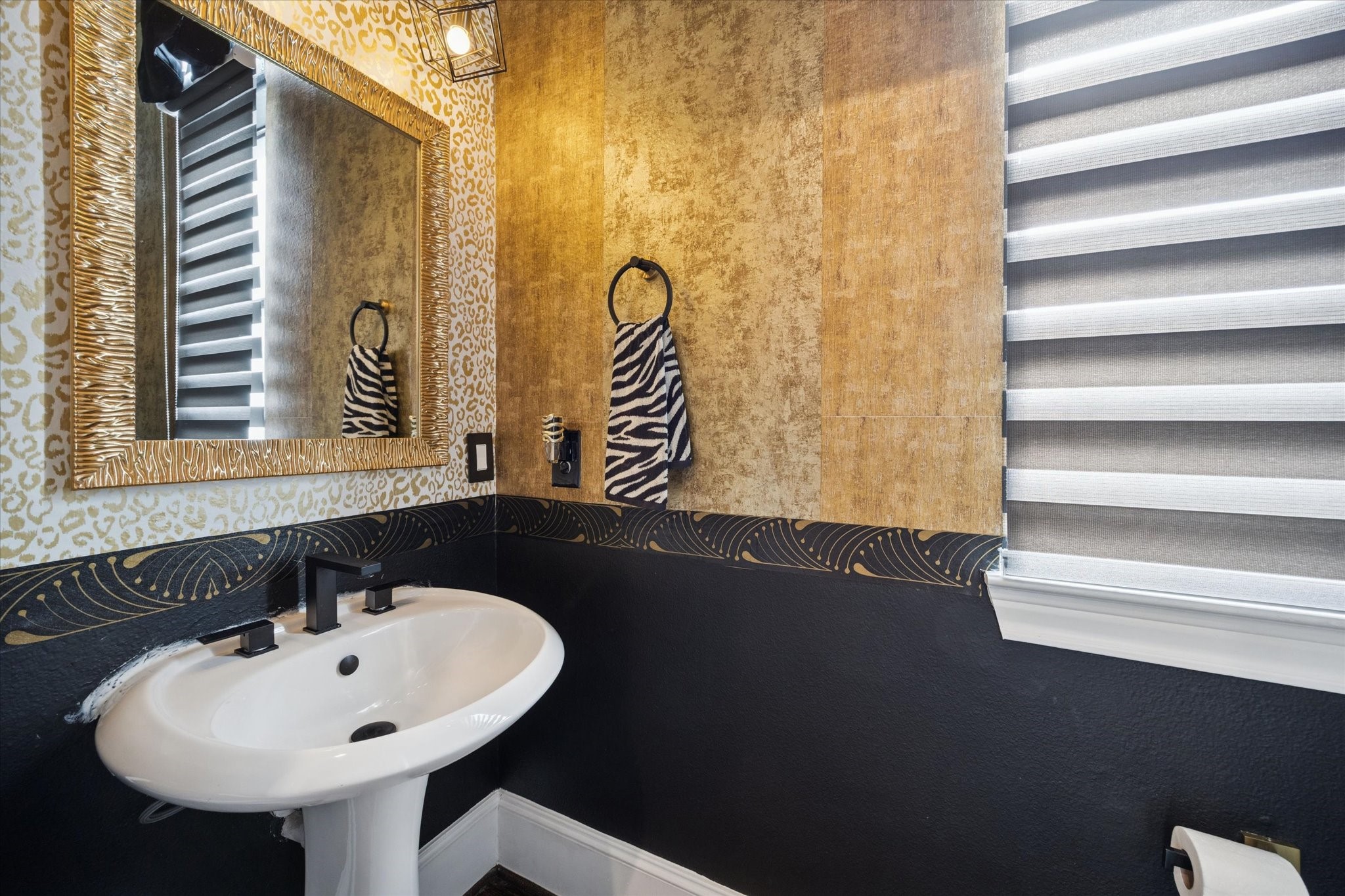 5820 Darling Street Houston, TX 77007 - Photo 20 of 24 a bathroom with a sink and a mirror