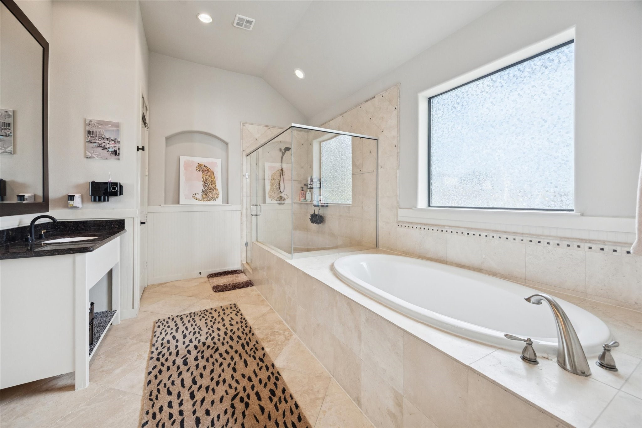 5820 Darling Street Houston, TX 77007 - Photo 8 of 24 a bathroom with a tub sink and mirror