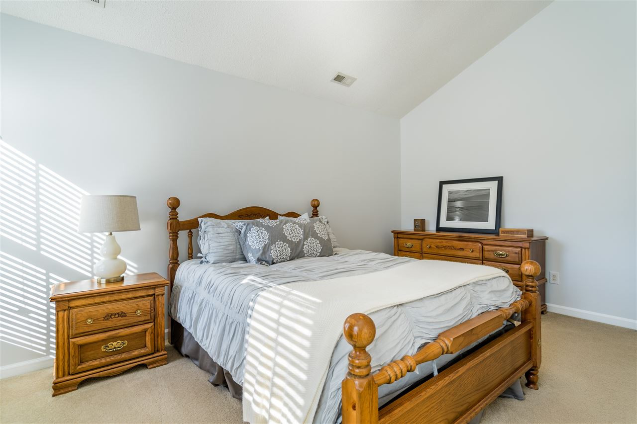 5221 Denmead Way Raleigh, NC 27613 - Photo 19 of 28 Light-filled owner's suite with vaulted ceilings and en suite bathroom and walk in closet! Owner's Suite