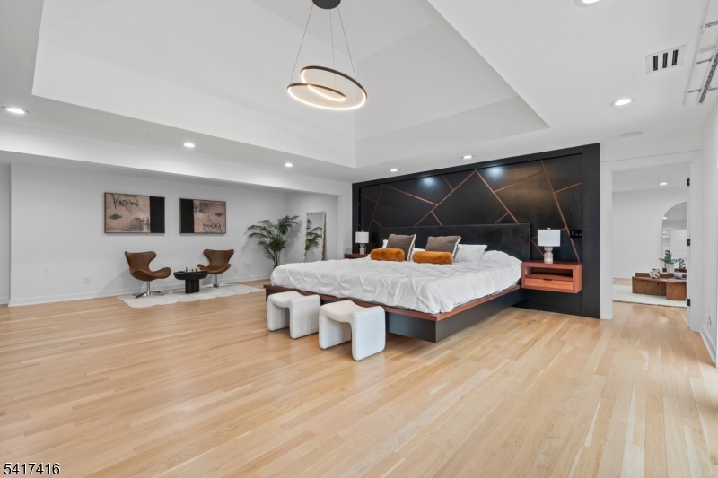 84 County Rte 635 Livingston, NJ 07039 - Photo 14 of 30 a bedroom with furniture and a large mirror