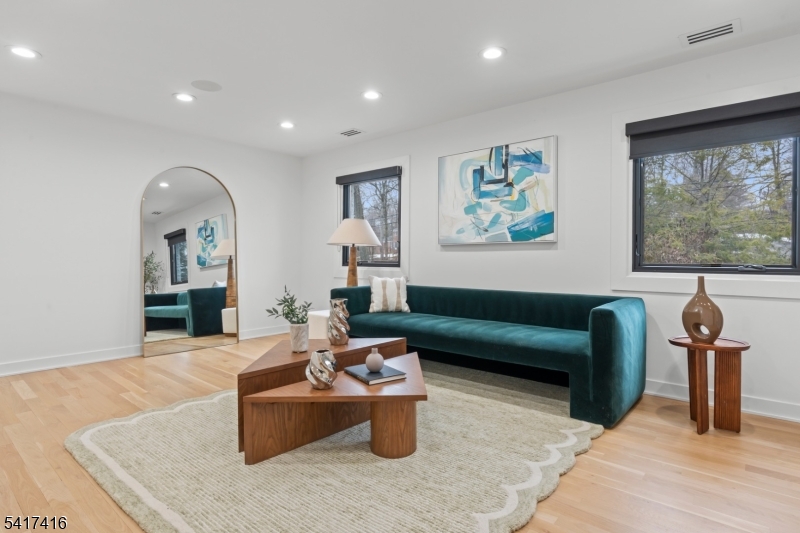 84 County Rte 635 Livingston, NJ 07039 - Photo 16 of 30 a living room with furniture and wooden floor