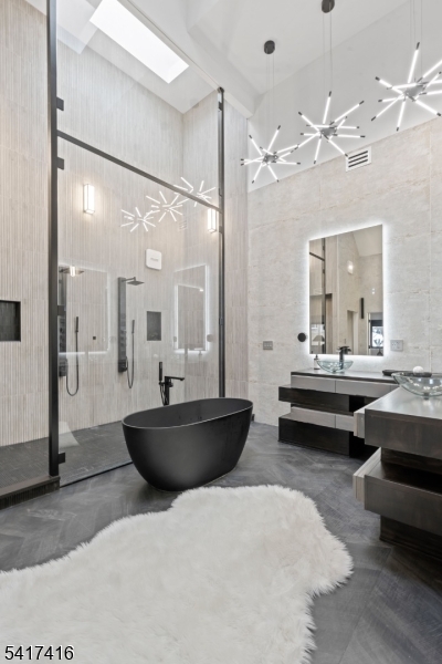 84 County Rte 635 Livingston, NJ 07039 - Photo 17 of 30 a bathroom with a double vanity sink a mirror and a bathtub