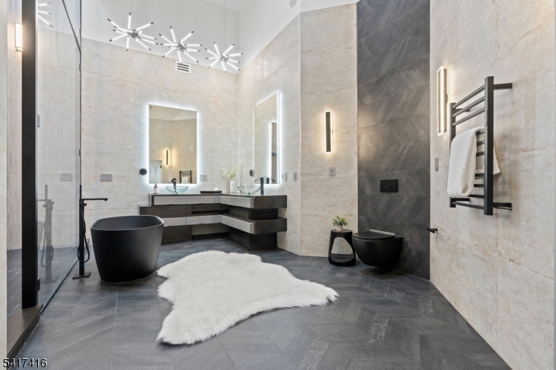 84 County Rte 635 Livingston, NJ 07039 - Photo 18 of 30 a living room with furniture and a chandelier