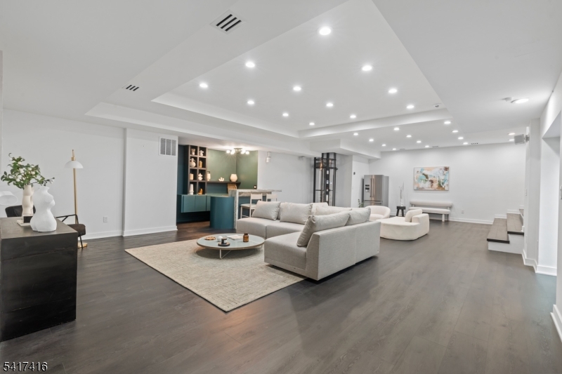 84 County Rte 635 Livingston, NJ 07039 - Photo 23 of 30 a living room with furniture and a table