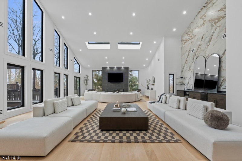 84 County Rte 635 Livingston, NJ 07039 - Photo 5 of 30 a living room with furniture and a flat screen tv