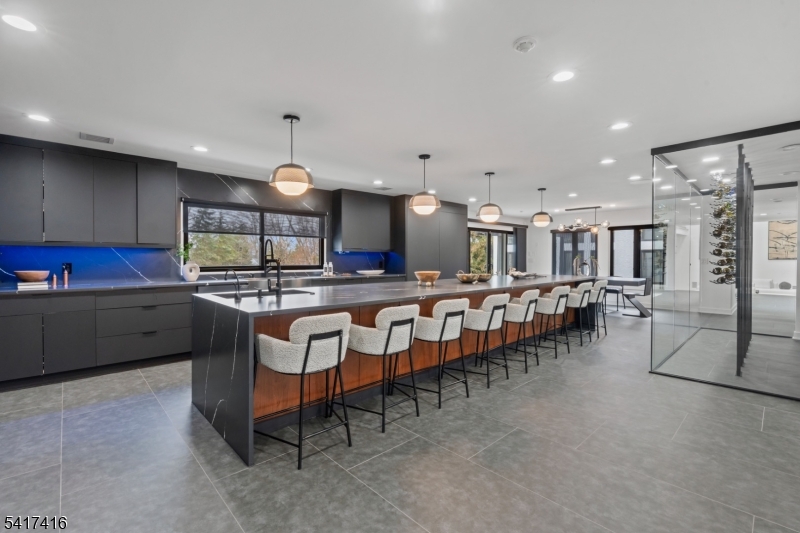 84 County Rte 635 Livingston, NJ 07039 - Photo 10 of 30 a kitchen with lots of wooden furniture appliances and a dining table