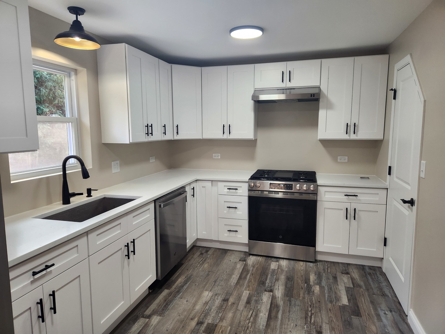 40 Lippincott Road Fox Lake, IL 60020 - Photo 8 of 22 a kitchen with a white cabinets stove and sink