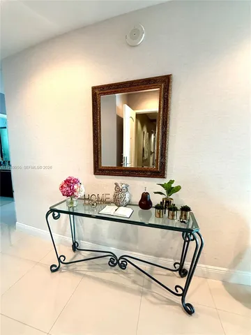 a bathroom with a sink mirror and vanity