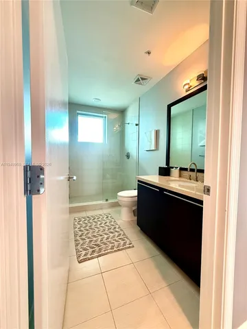 a bathroom with a bathtub a sink and a mirror