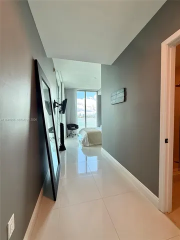 a view of a livingroom with furniture and a window
