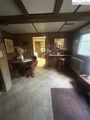 a room with furniture and a flat screen tv