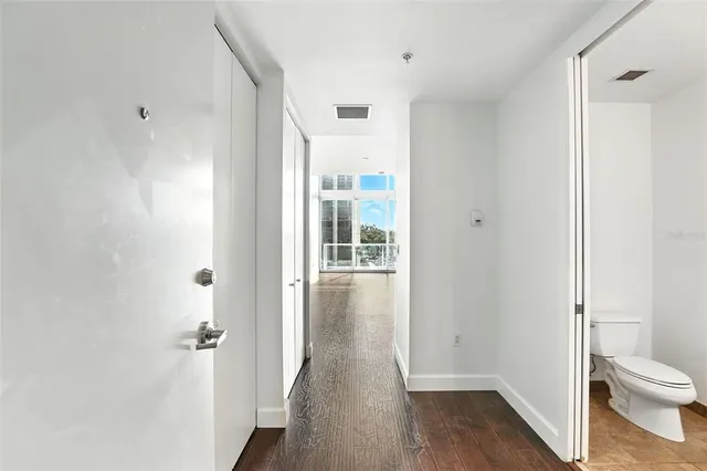 a kitchen with granite countertop a stove a sink and a microwave