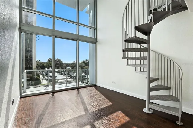 a view of staircase with white walls and windows