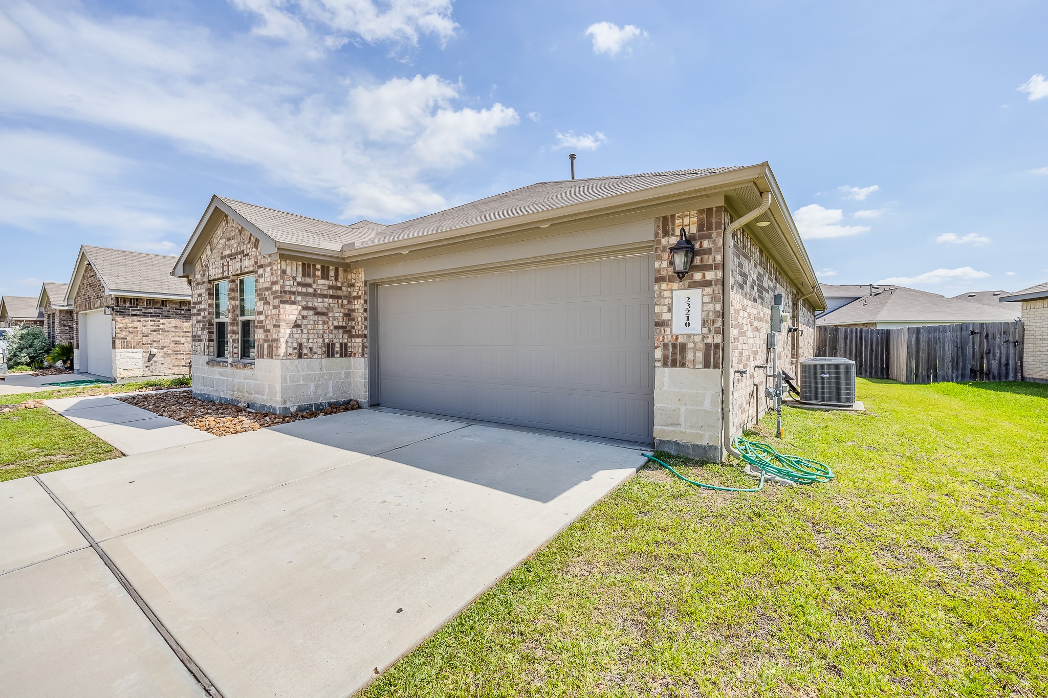 23210 Barberry Crk Trail Spring, TX 77373 - Photo 28 of 33 a view of a house with a patio