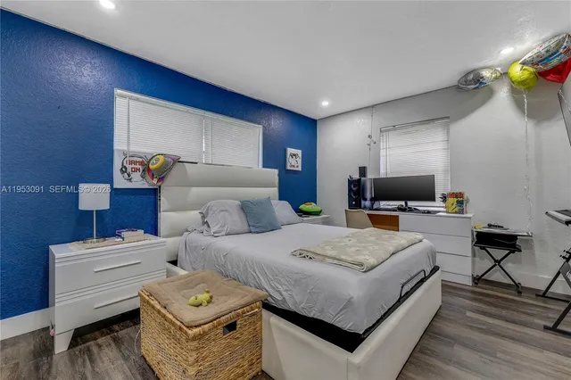 a bathroom with a toilet a sink and a mirror