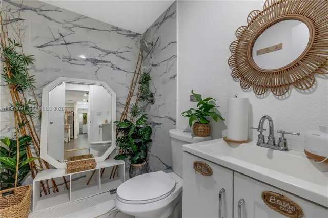 a bedroom with furniture and a wooden floor