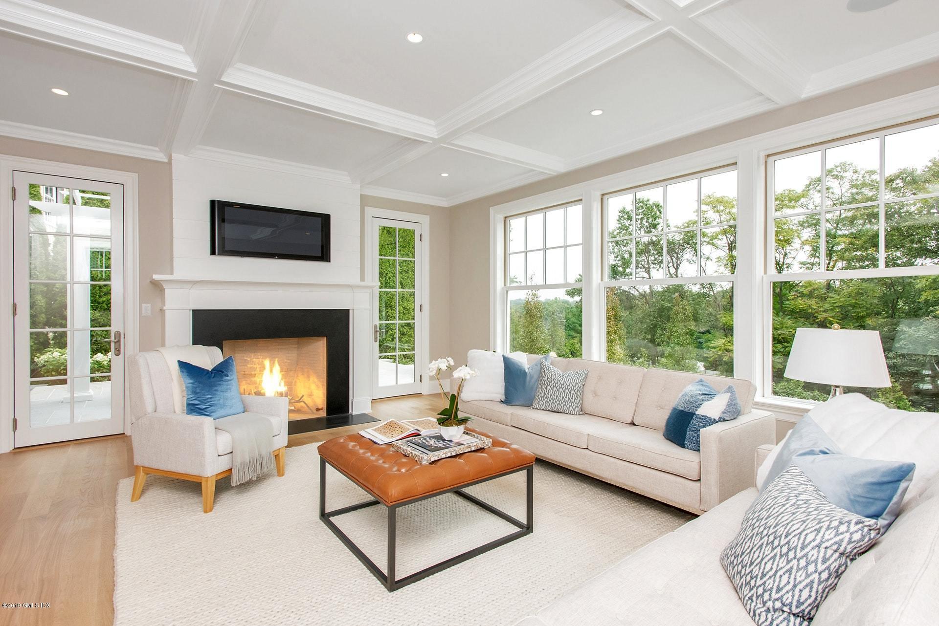 53 Sheep Hill Road Riverside, CT 06878 - Photo 4 of 10 a living room with furniture and a fireplace