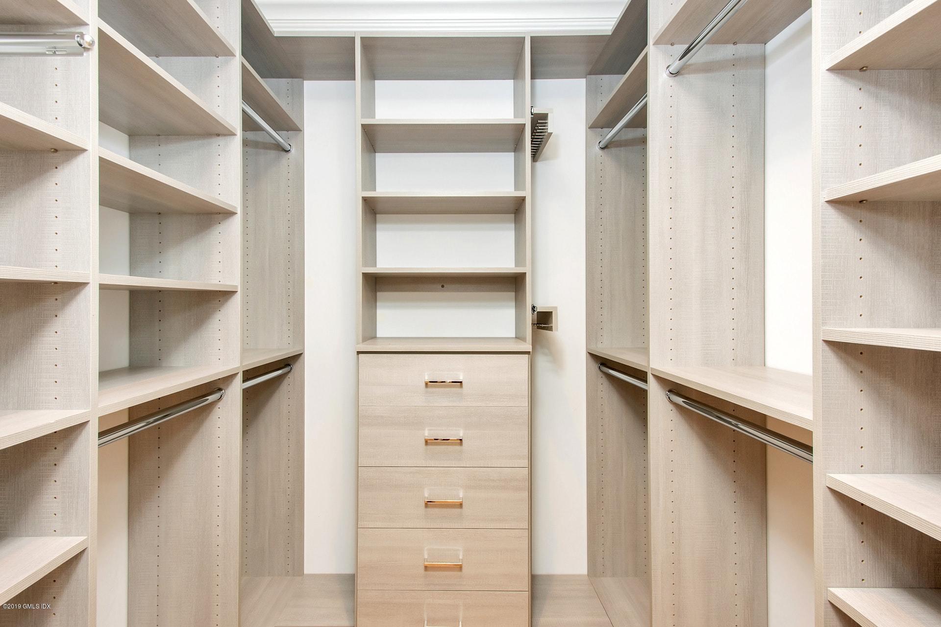 53 Sheep Hill Road Riverside, CT 06878 - Photo 8 of 10 a view of walk in closet with empty racks